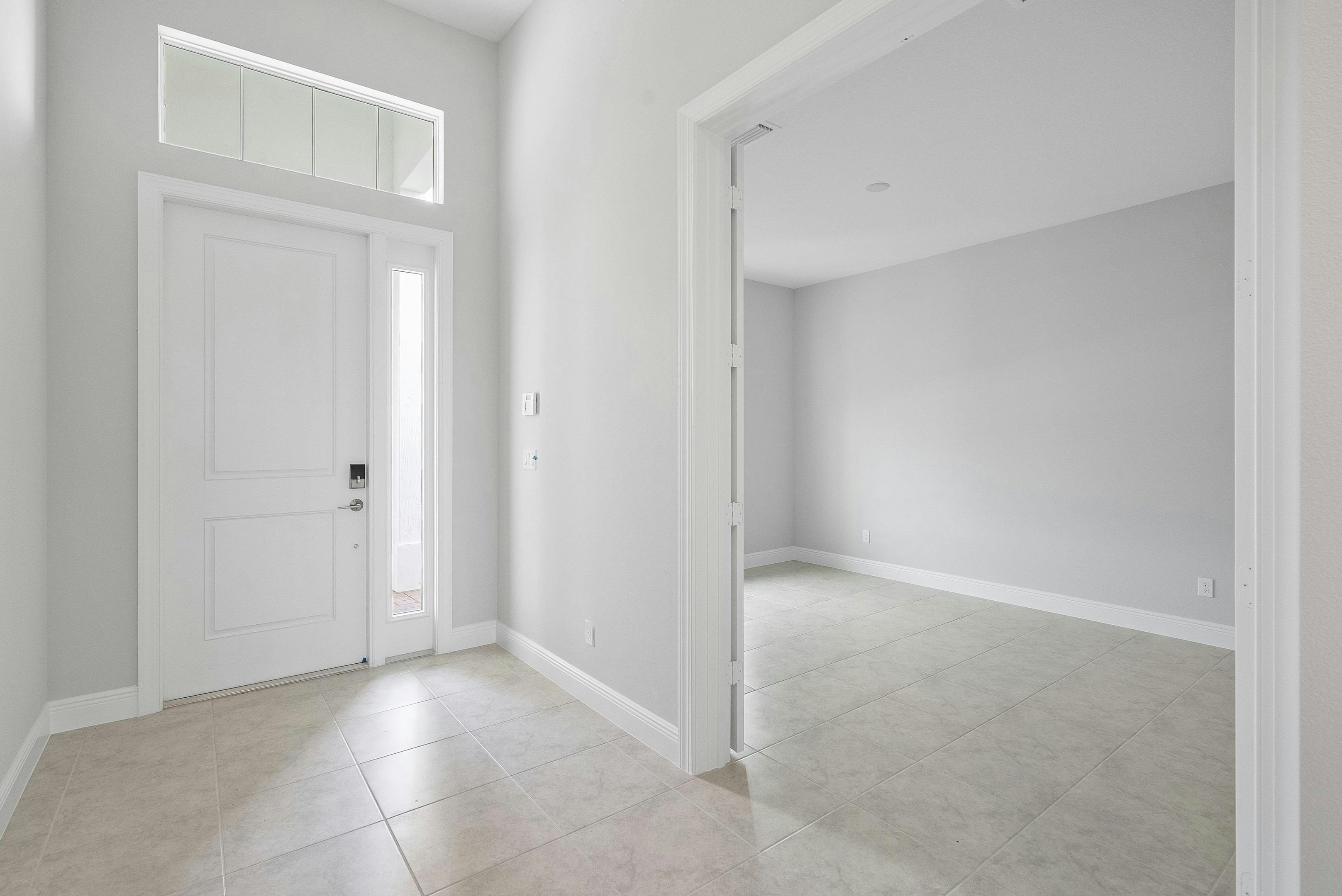 Foyer and Den | 12398 SW Sunrise Lake Terrace