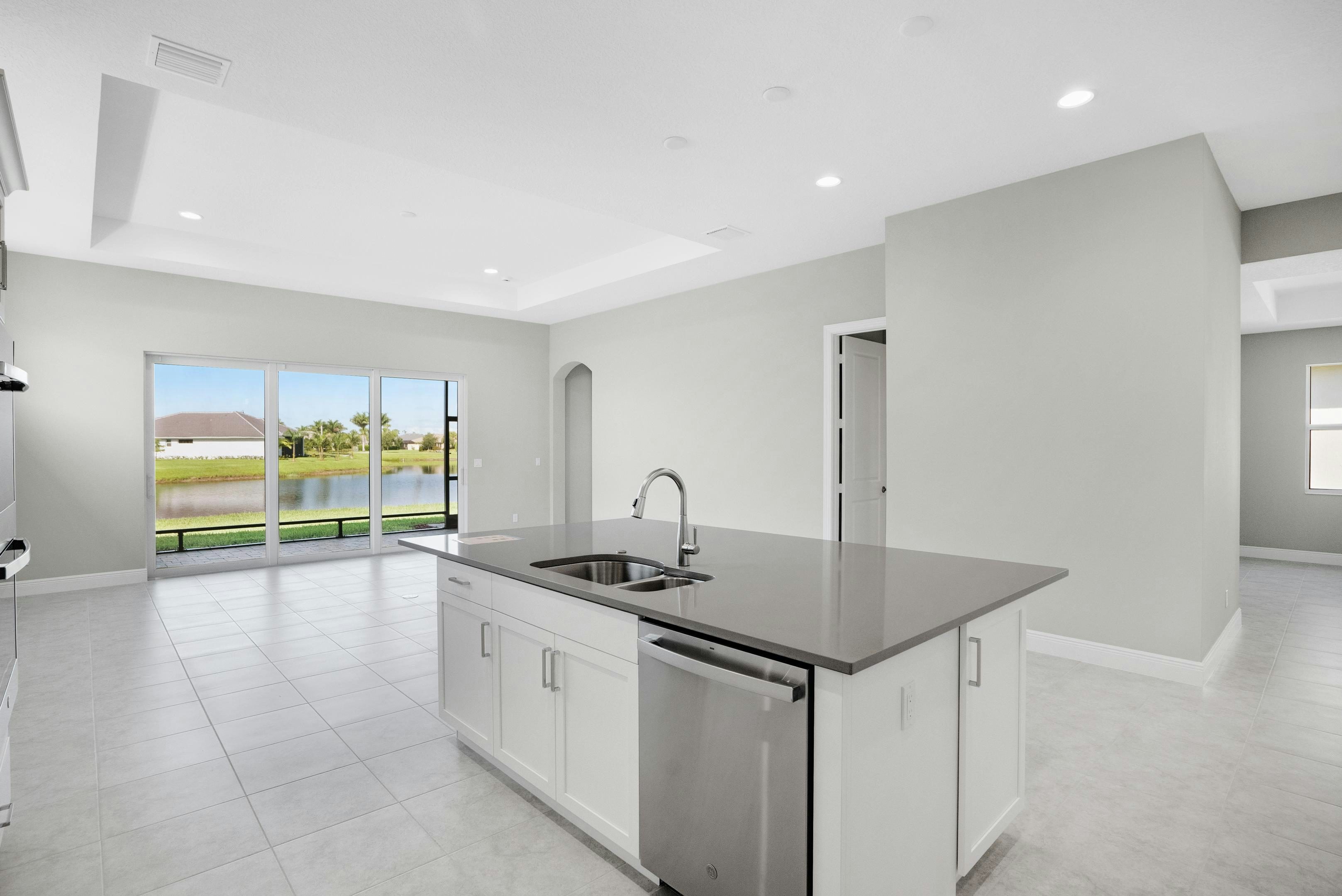 Kitchen to Great Room & Lanai | 12446 SW Sunrise Lake Terrace