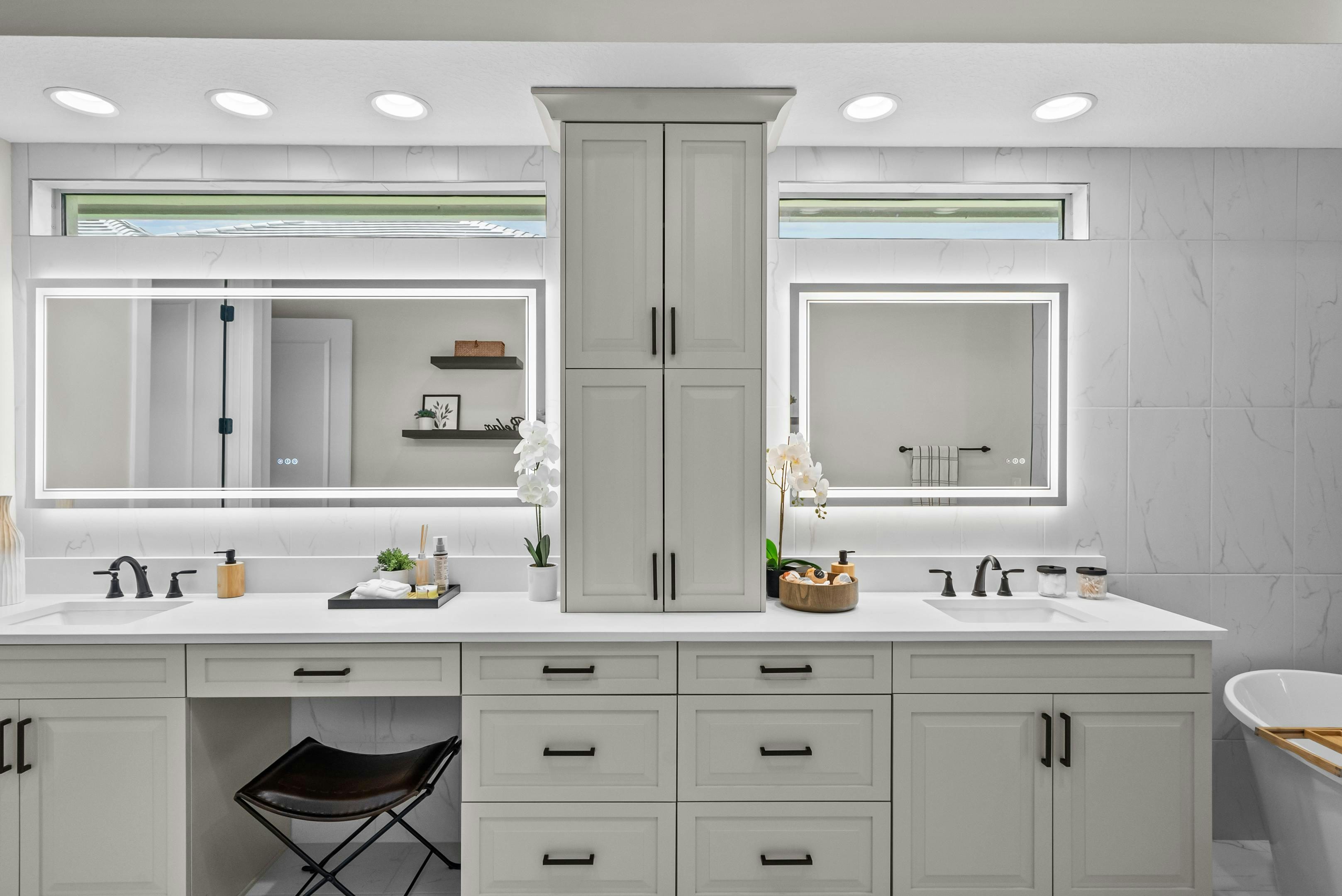 Master Bath in grey tones with dual vanity and LED light mirrors