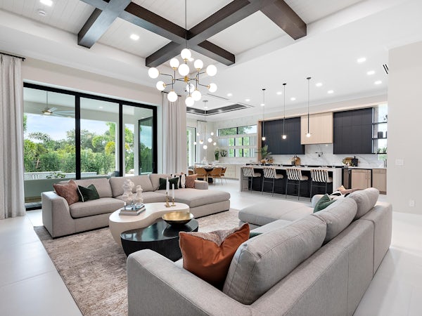 Great Room | Keenan Model Great room with black box beams looking to kitchen modern black cabinets