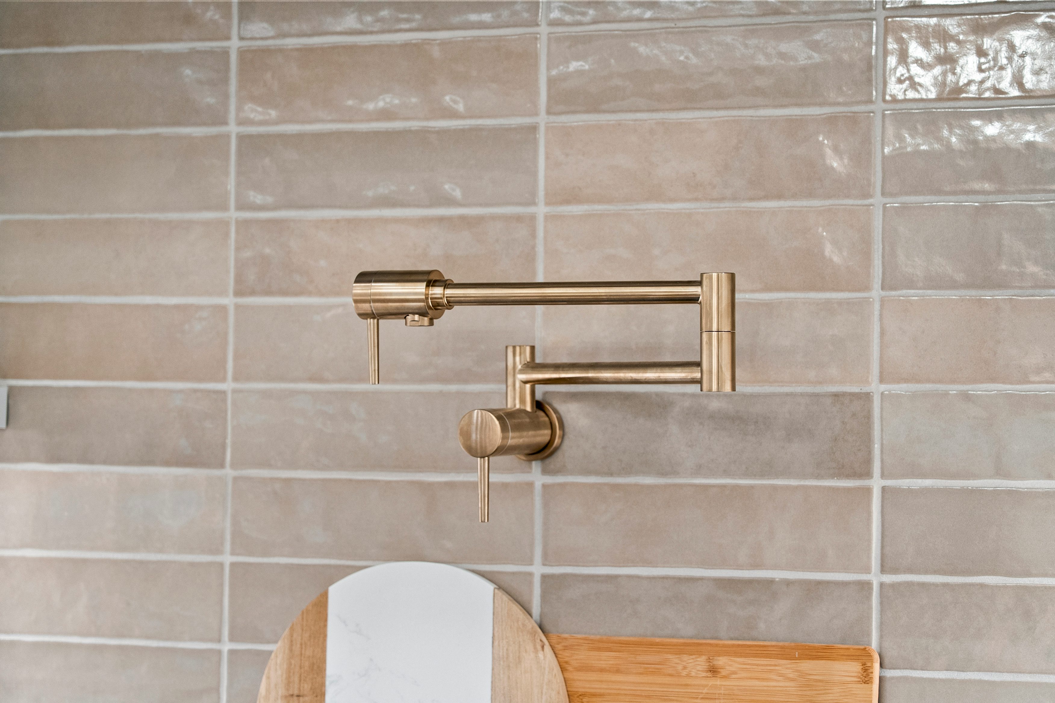 Beige Tile Backsplash and Gold Pot Filler | Design Studio