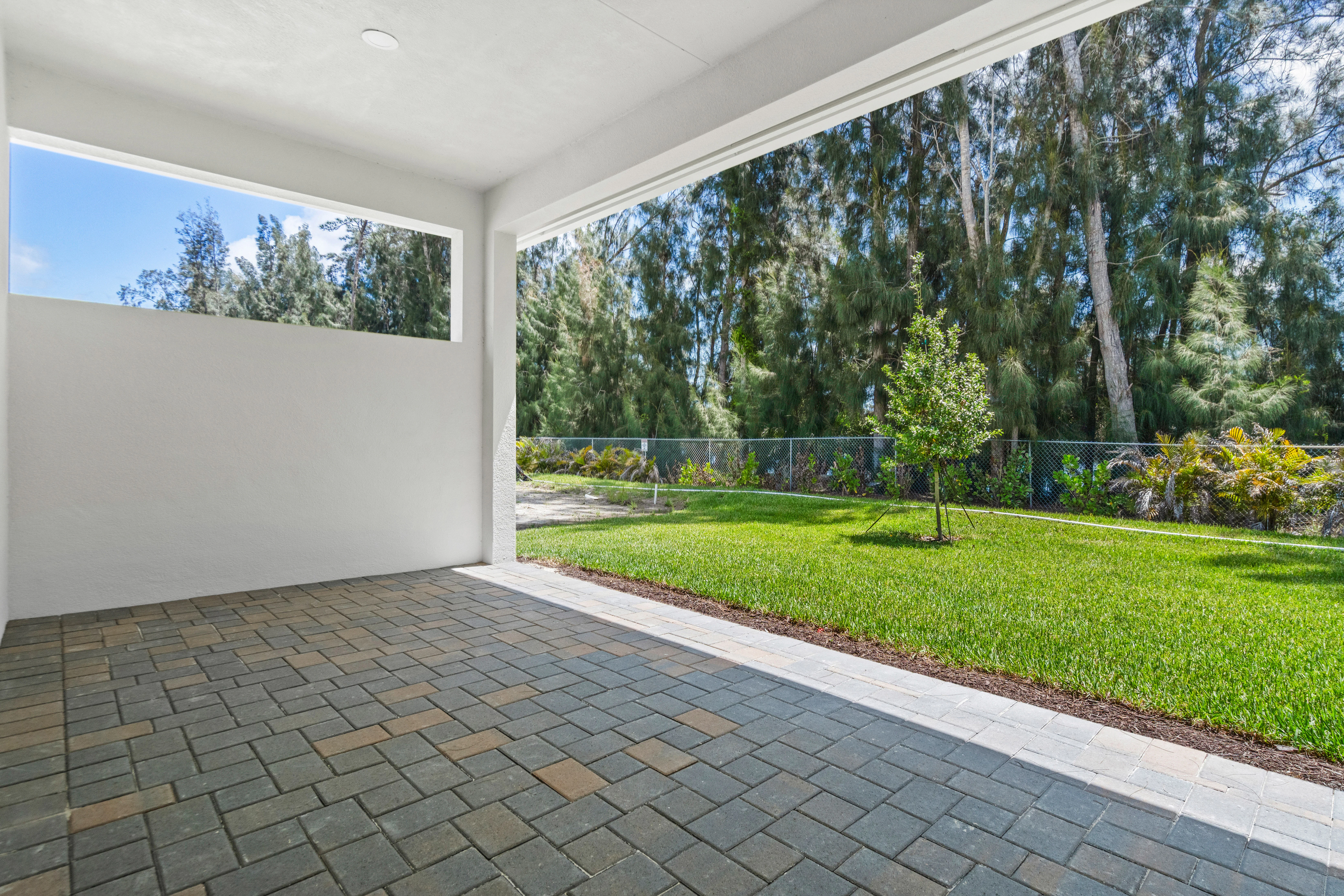 Lanai with Privacy Wall and view to Backyard | 692 Ravens Landing Drive